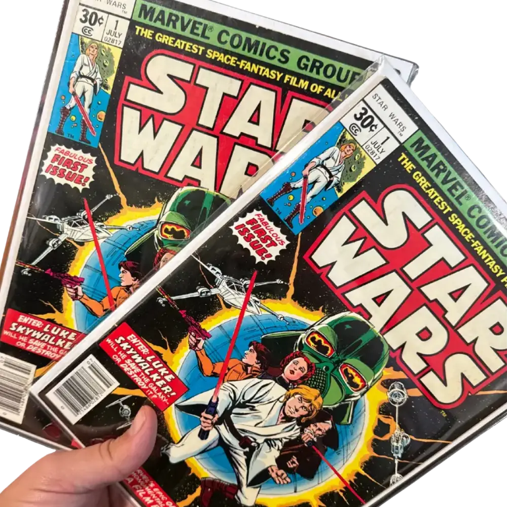 Comic issues fanned out in protective sleeves